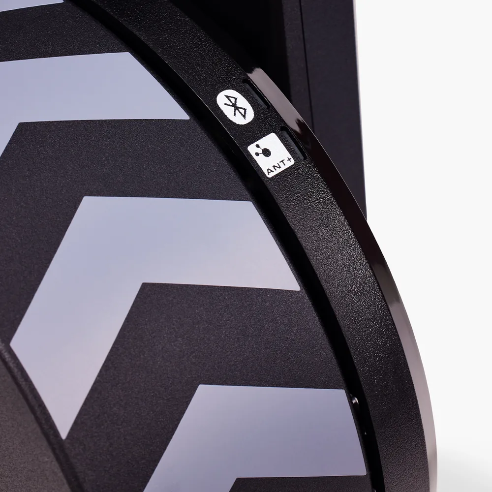 KICKR CORE flywheel with ANT+ and Bluetooth markings