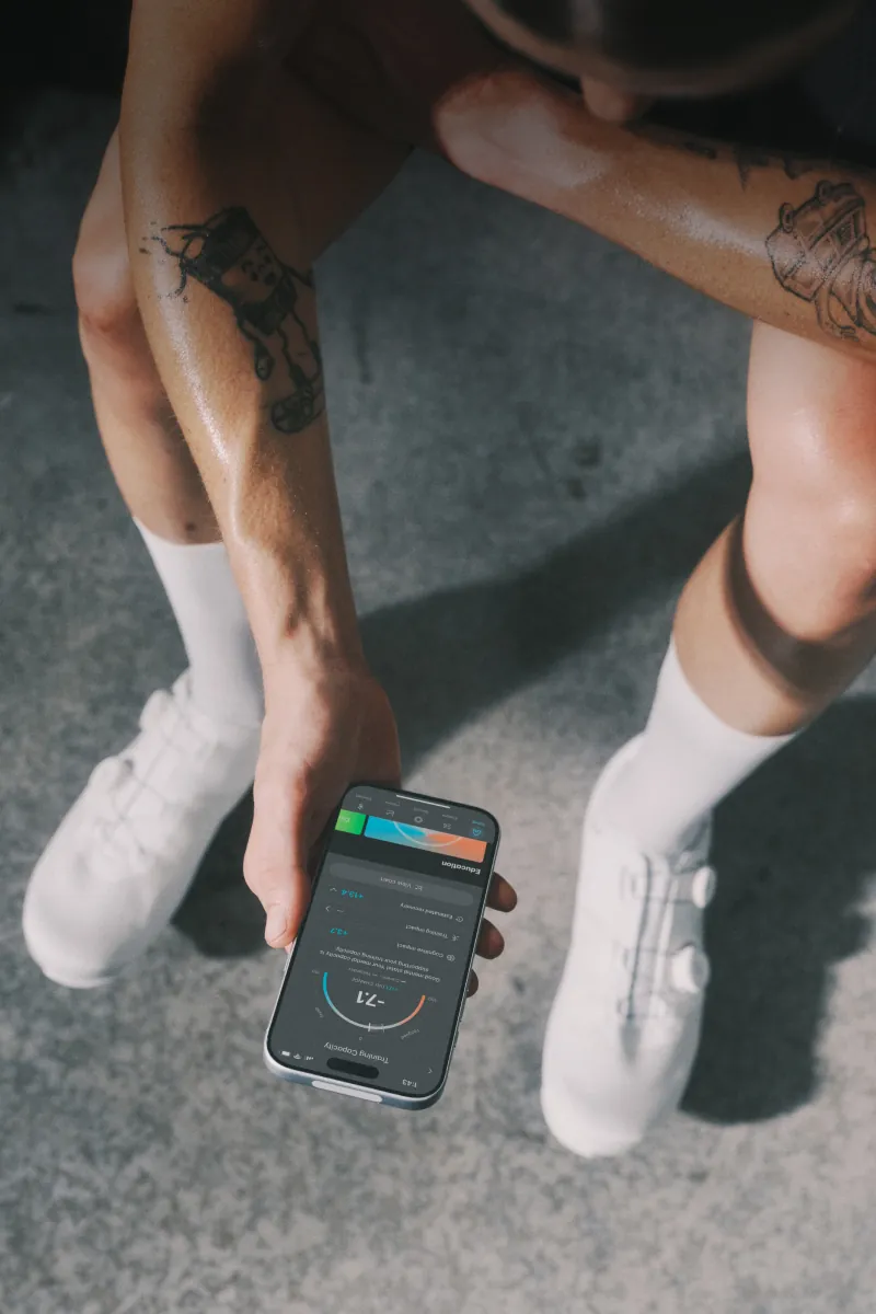 Athlete checking workout stats on their phone